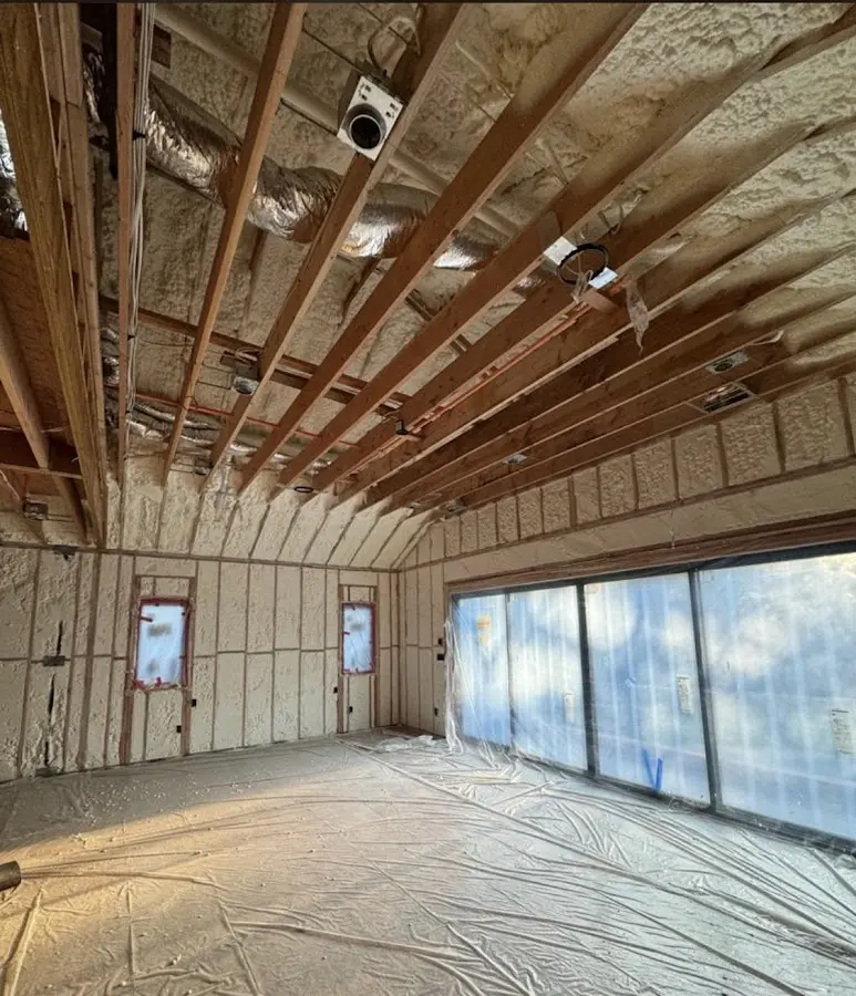 Interior walls and ceiling insulated with spray foam during new construction in Central City